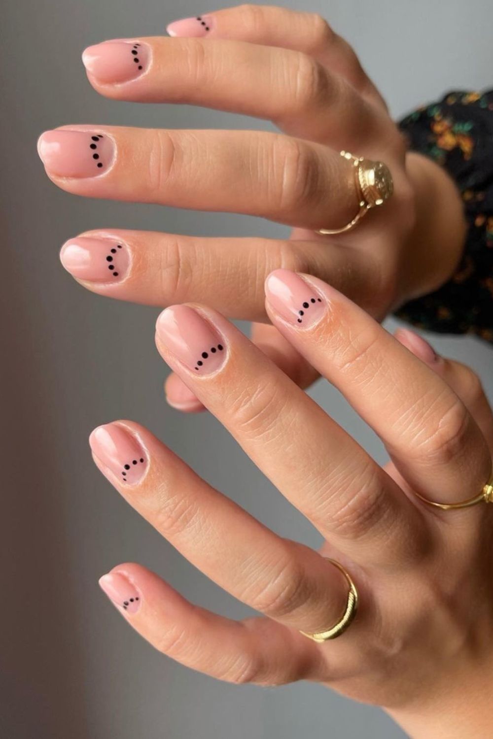 Nude nails with black dot half moons