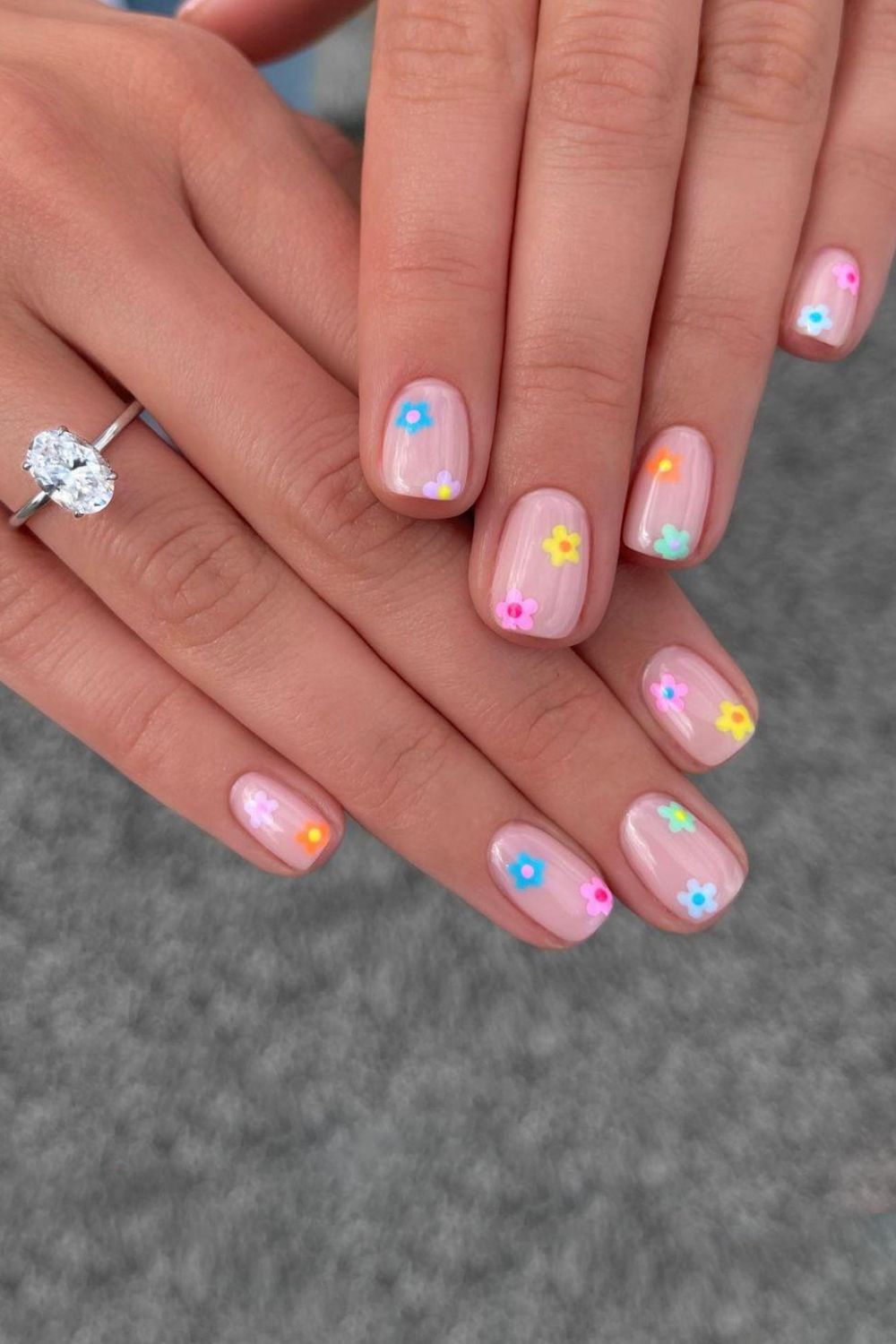 Nude nails with colorful ditsy flowers