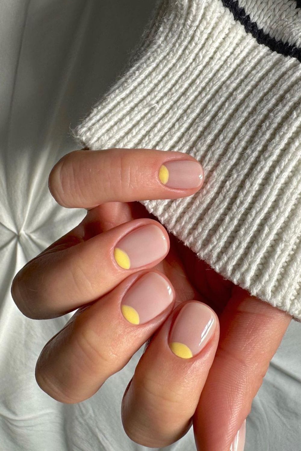 Nude nails with yellow half moon accents