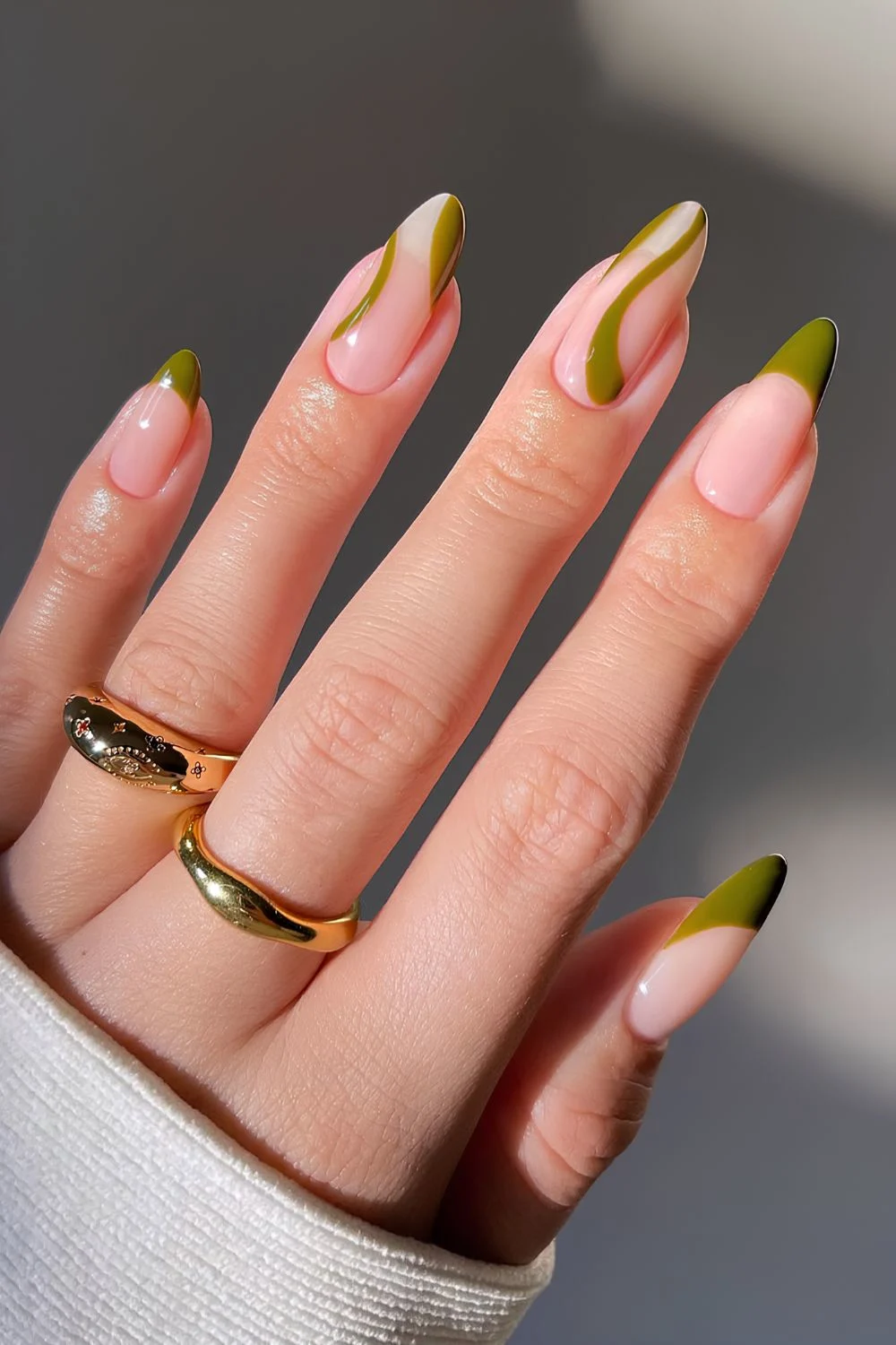 Olive green French mani with accent swirls