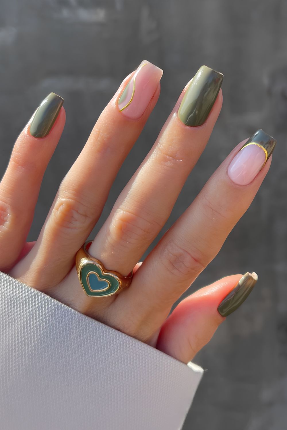 Olive green nails with accent gold lines