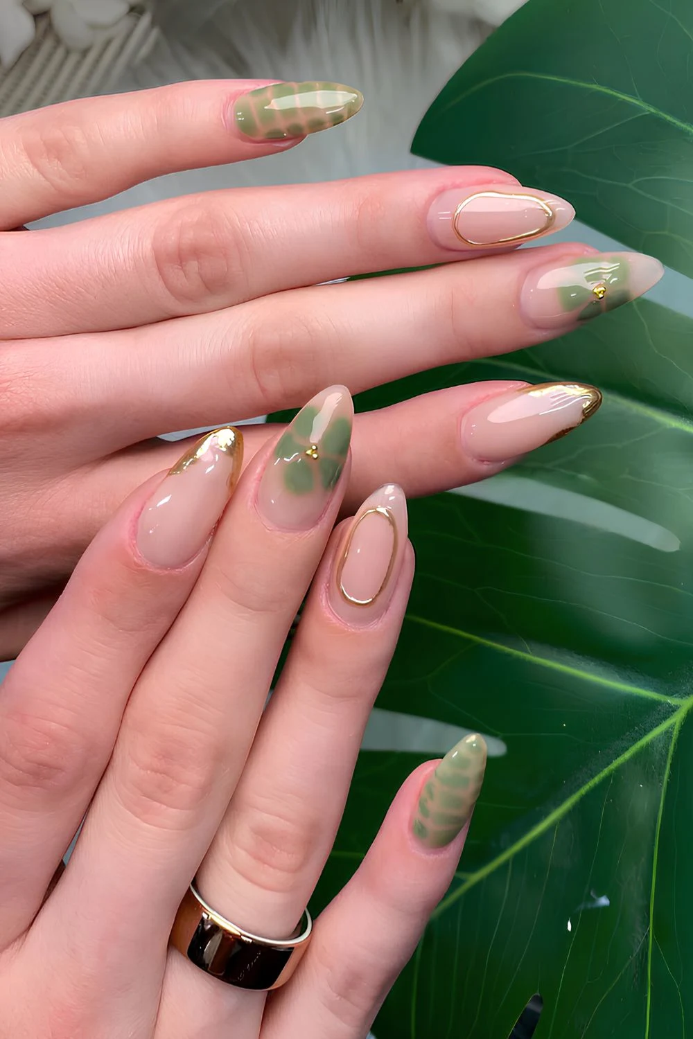 Olive green nails with blooming flowes