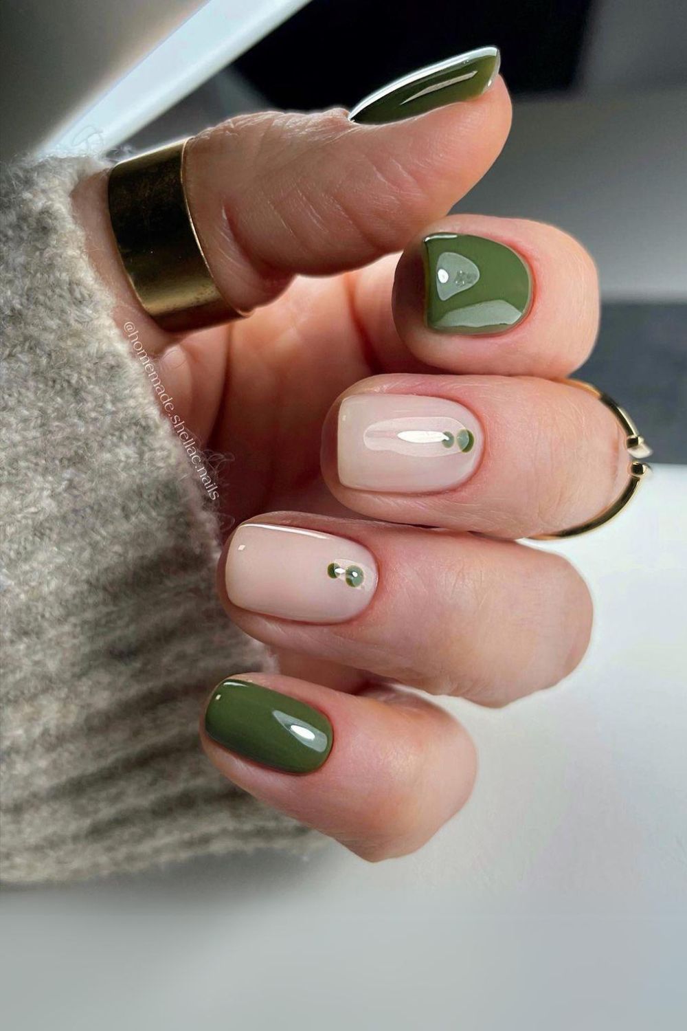 Olive green nails with dot accents