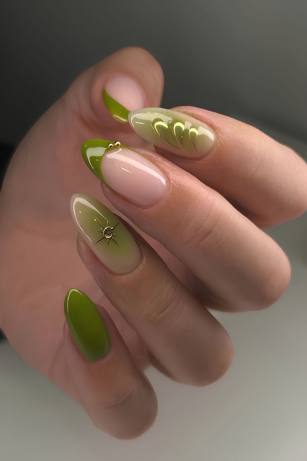 Olive green nails with rhinestones and gold details