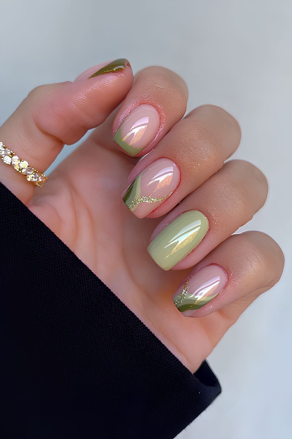 Olive green nails with swirls and glitter