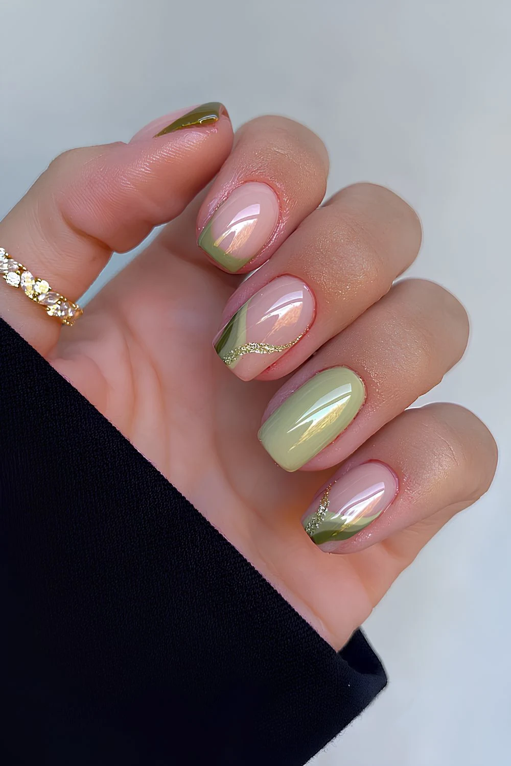 Olive green nails with swirls and glitter