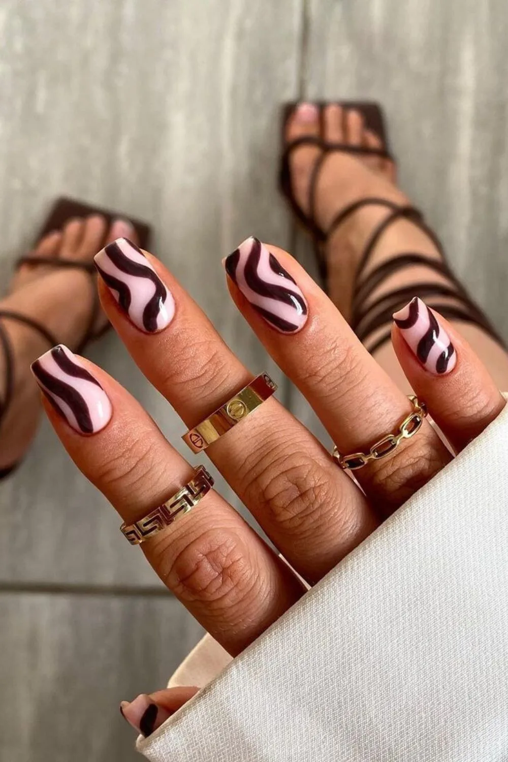 Pink nails with chocolate brown swirls