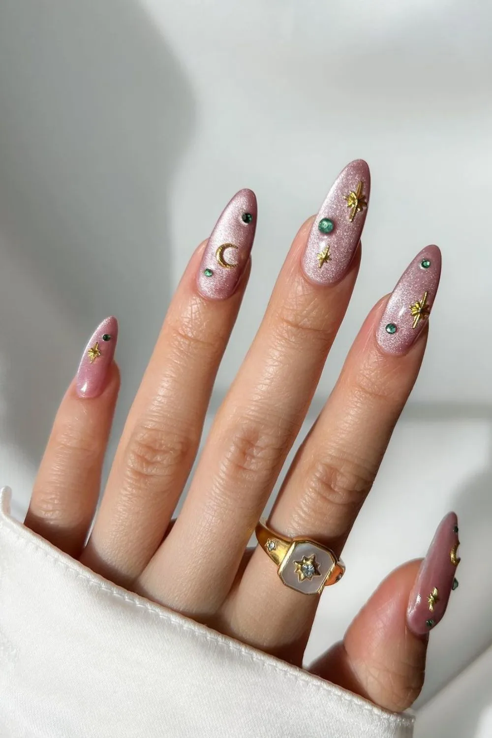 Pink velvet nails with celestial charms