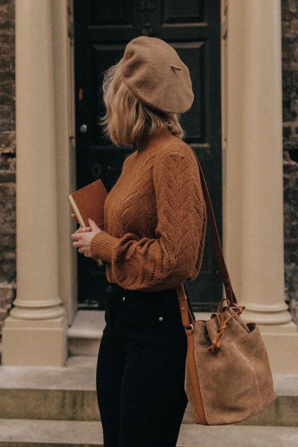 Rust sweater and black jeans