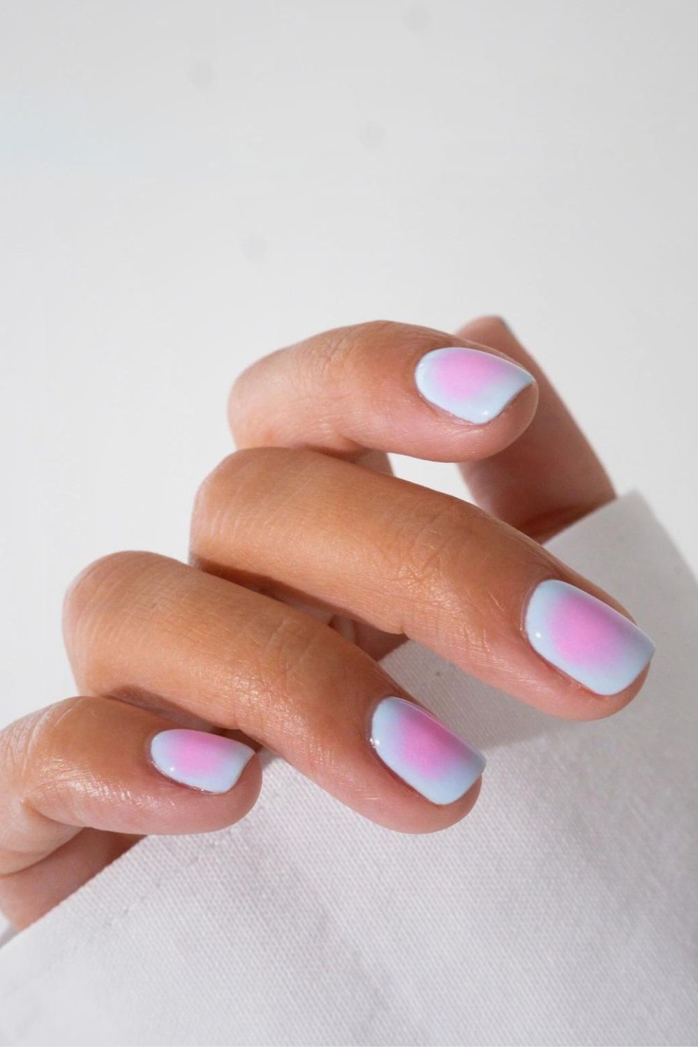 Short blue and pink aura nails