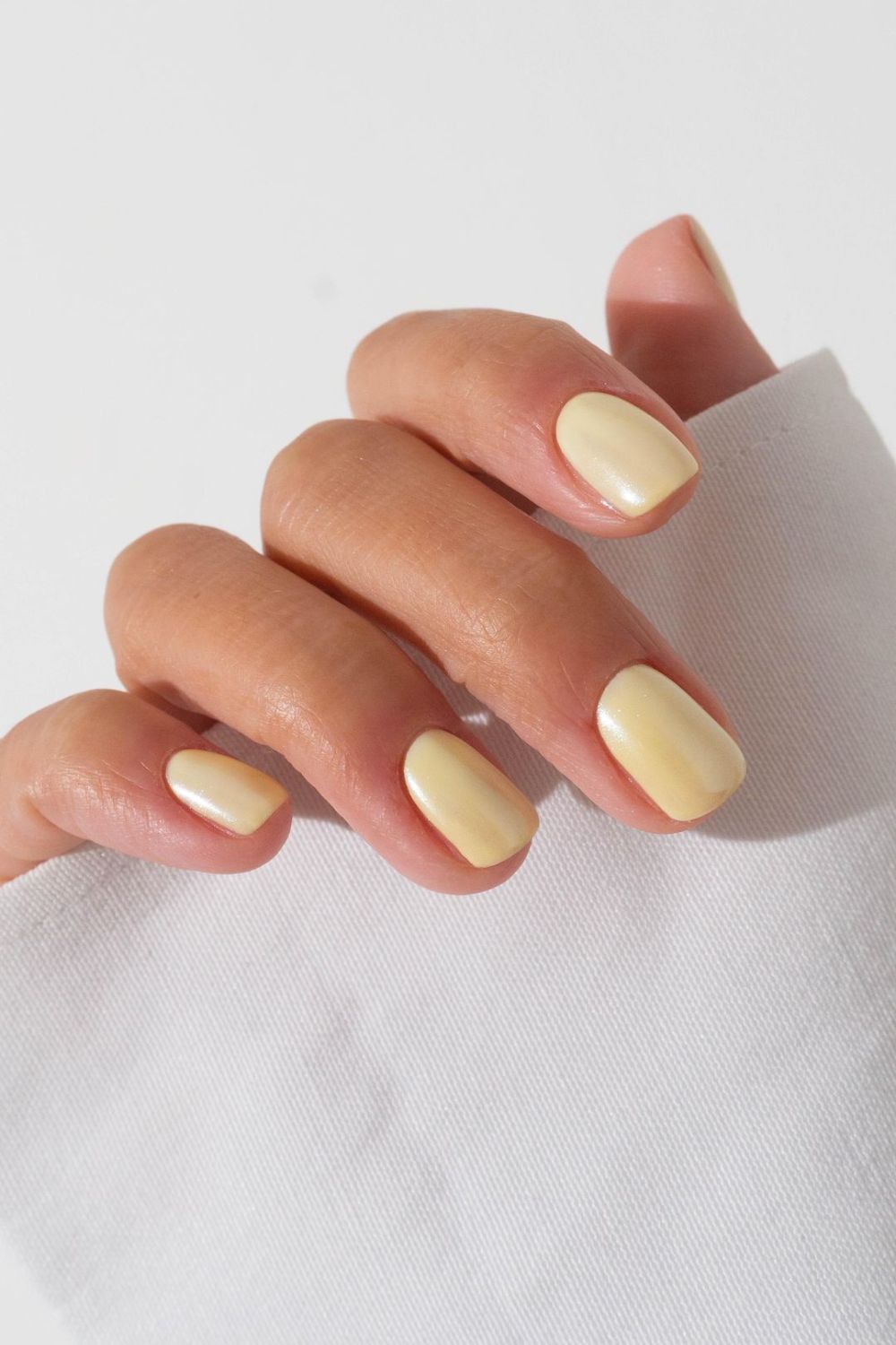 Short butter yellow nails