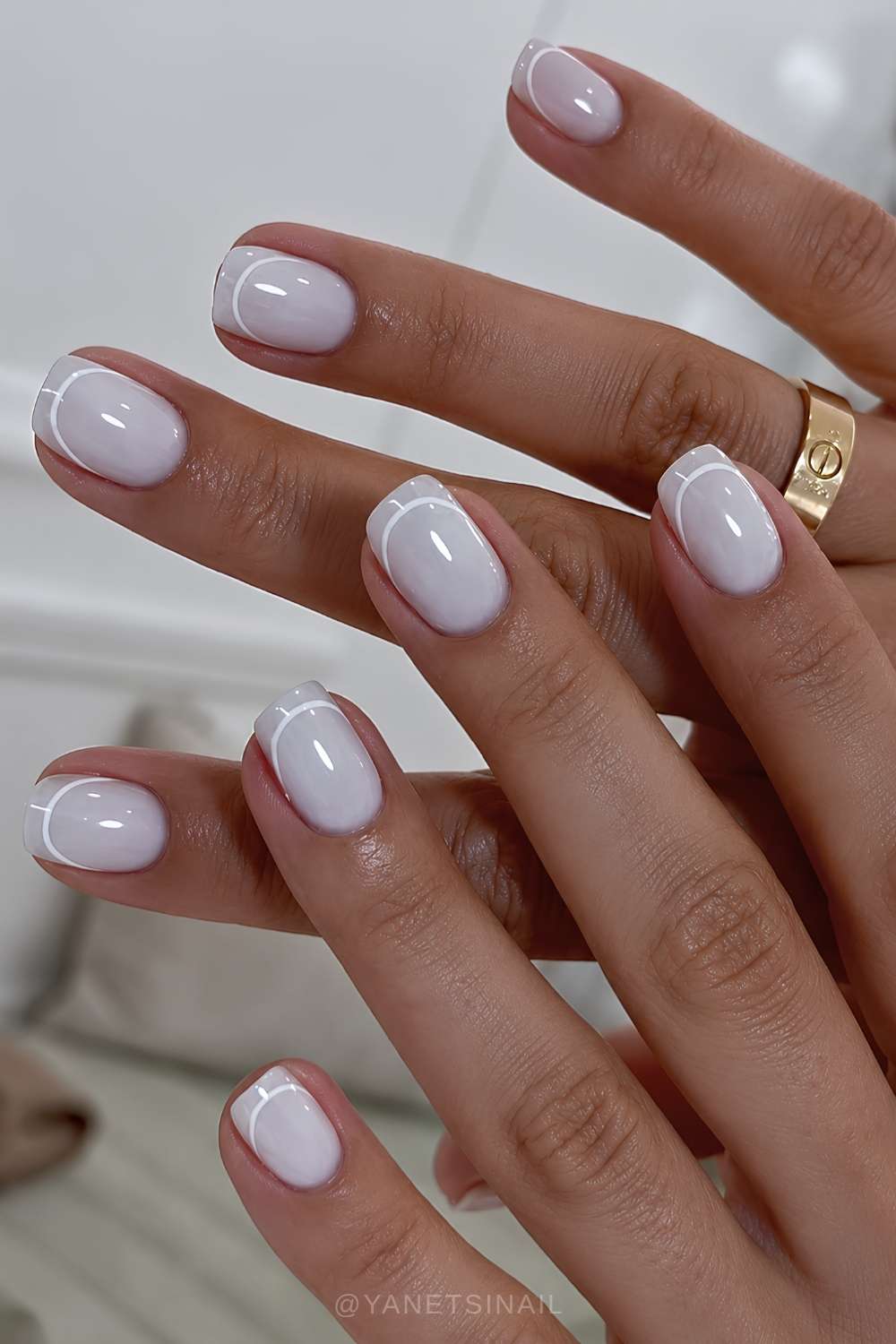 Short milky white nails with French tip outlines
