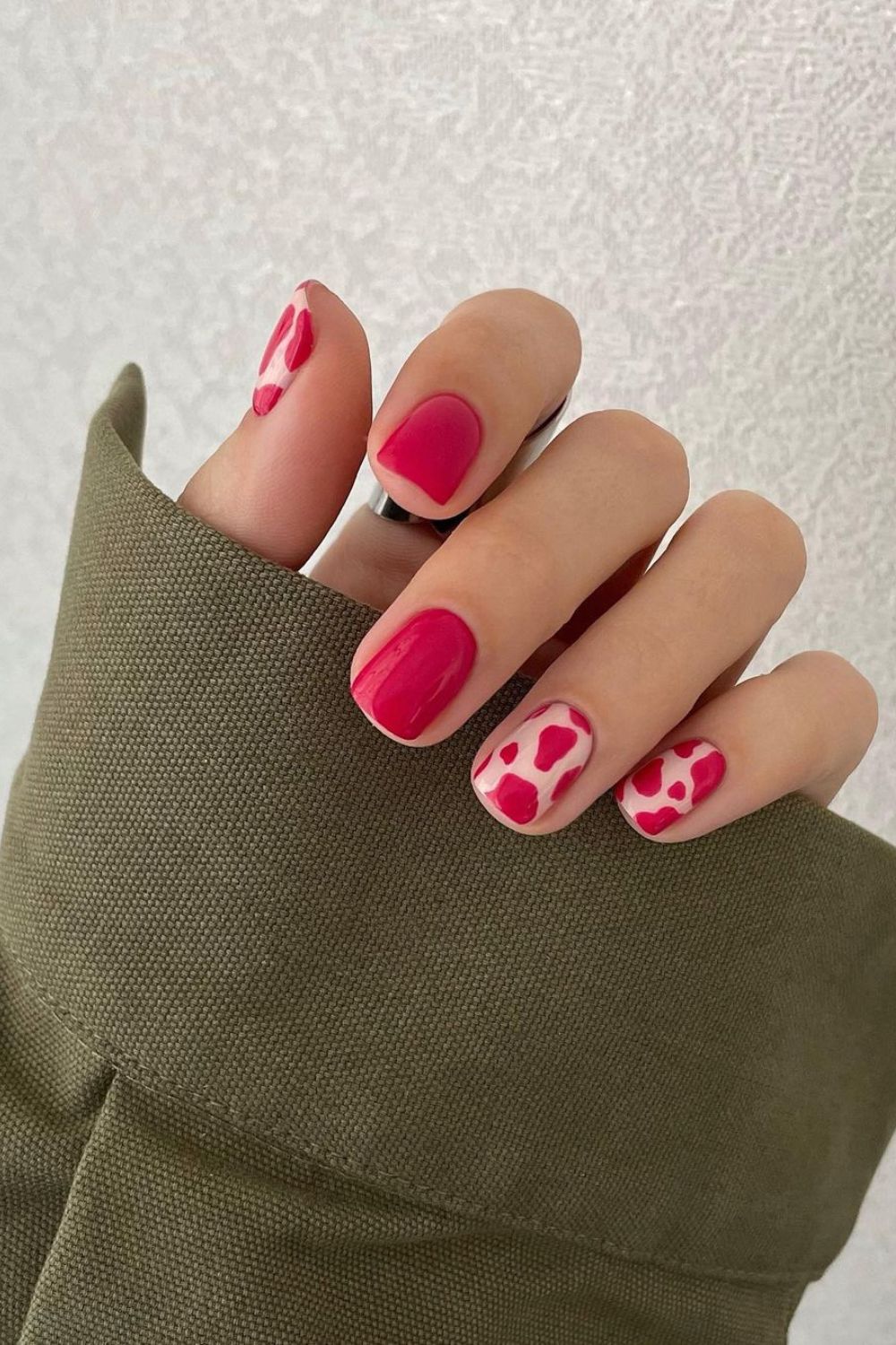 Short red cow print nails