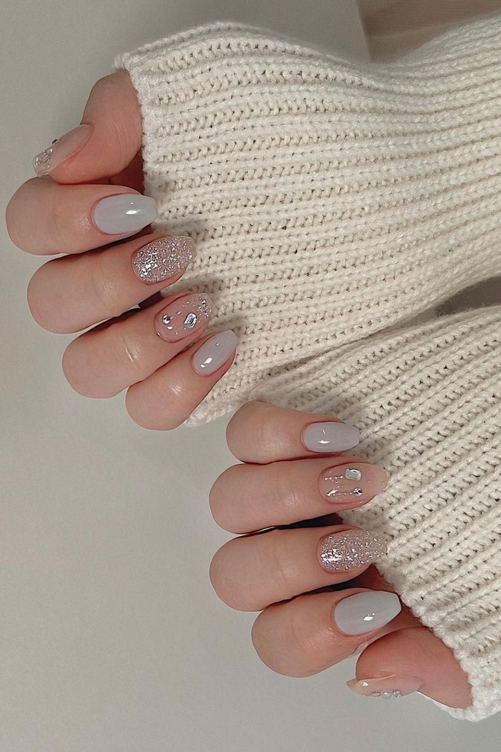 Soft gray nails with rhinestones