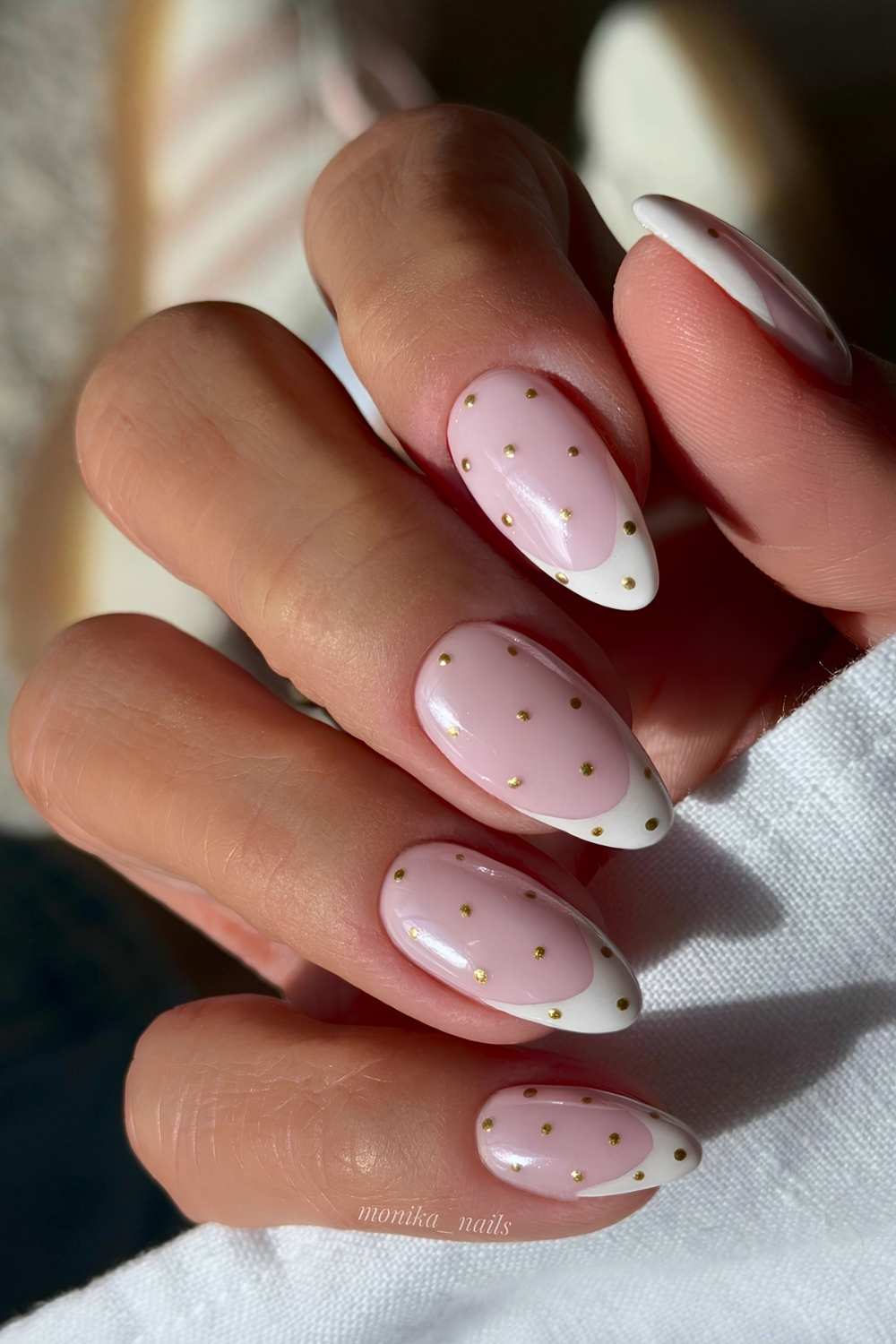 White french nails with gold polka dots