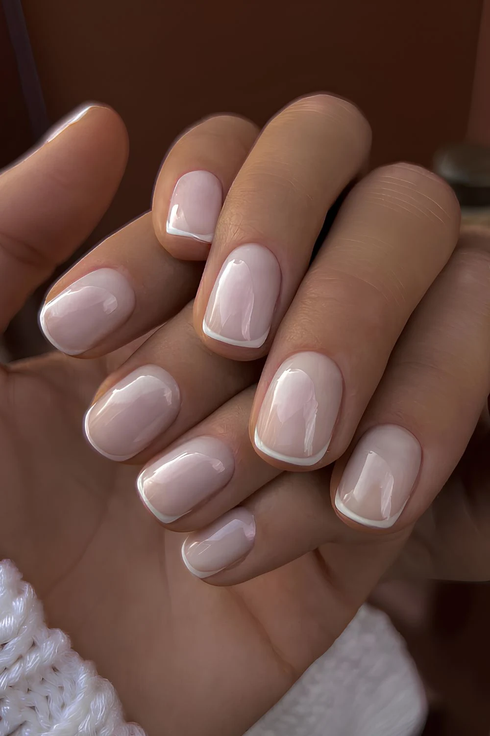 White micro French manicure on milky base