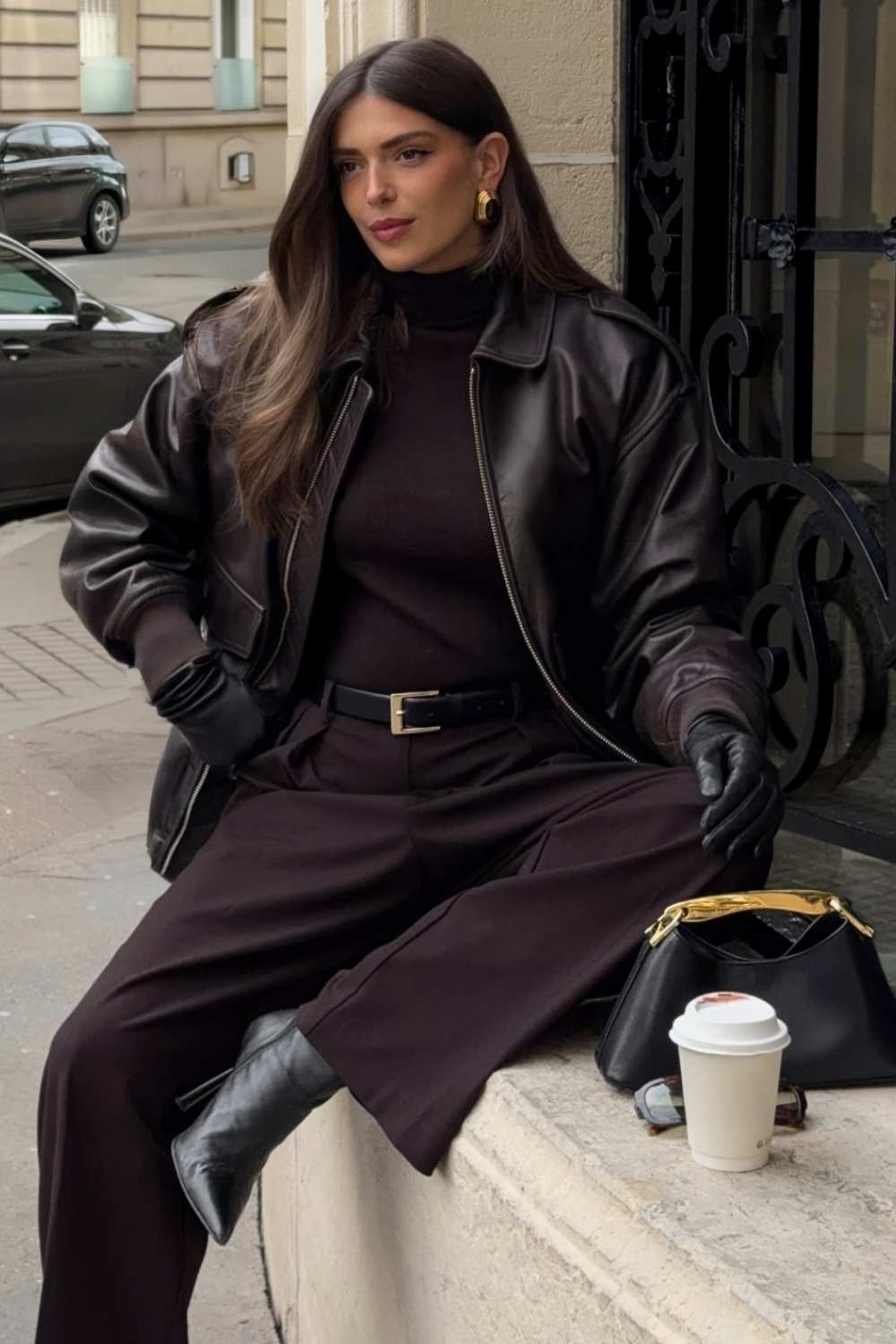 brown leather bomber jacket with brown turtleneck and trousers