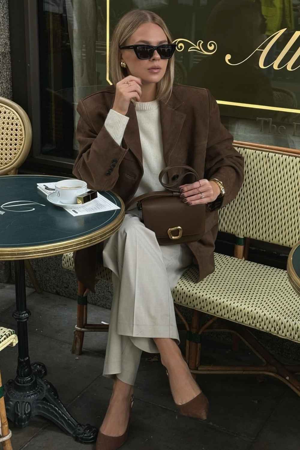 brown suede blazer with cream sweater and gray trousers