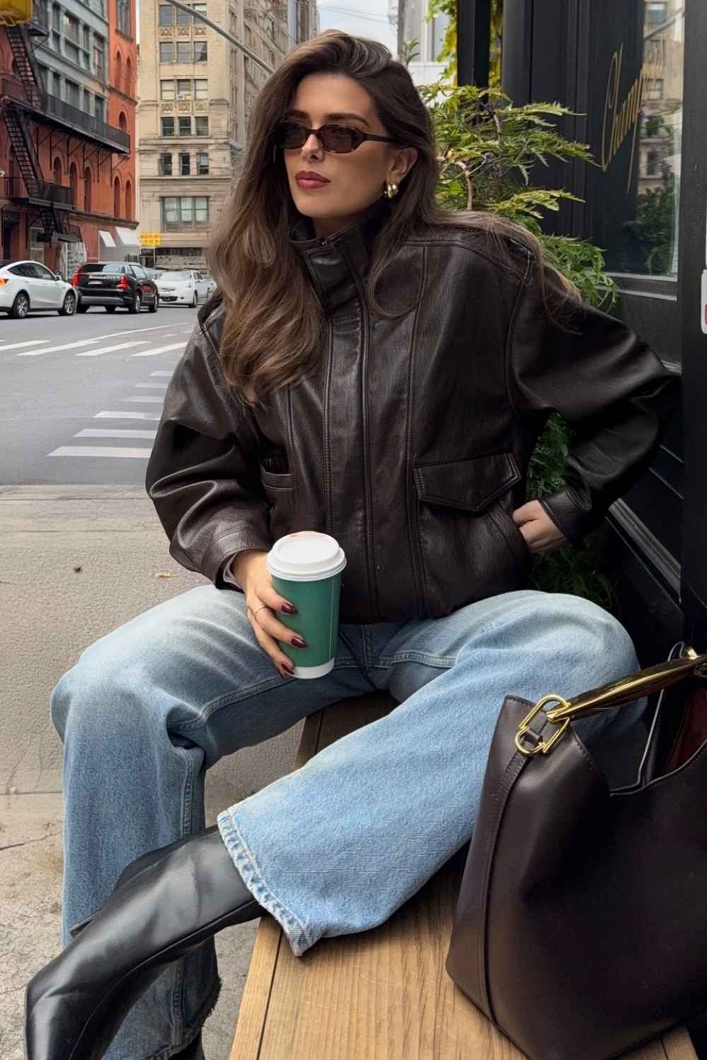 leather bomber jacket with jeans and black boots
