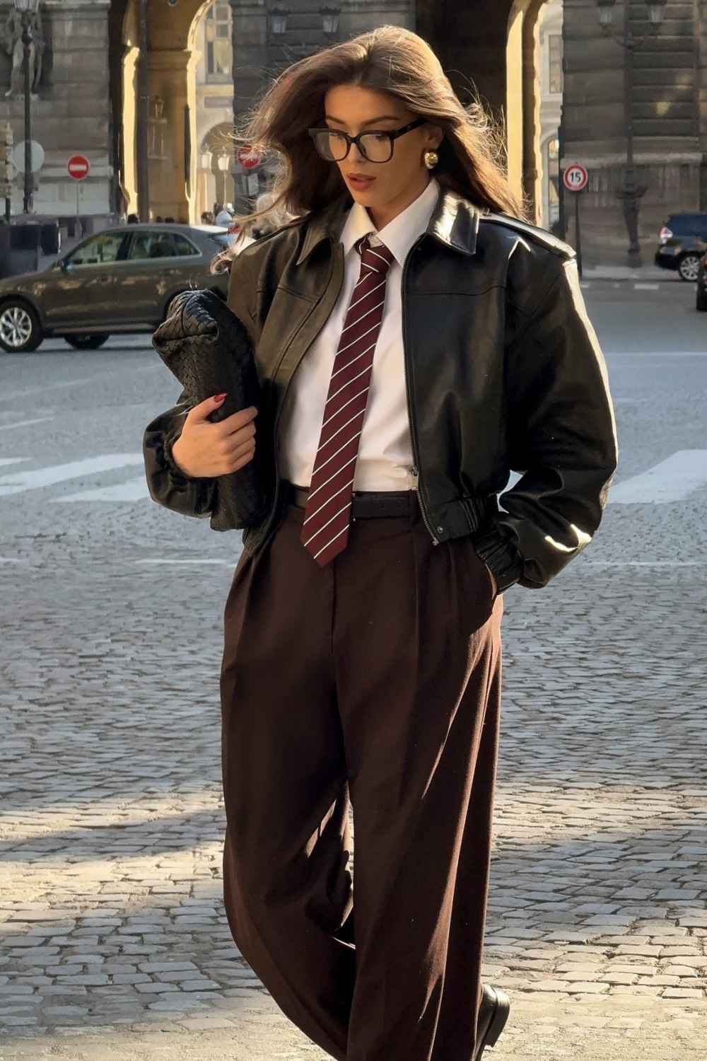 leather jacket with white shirt and striped tie