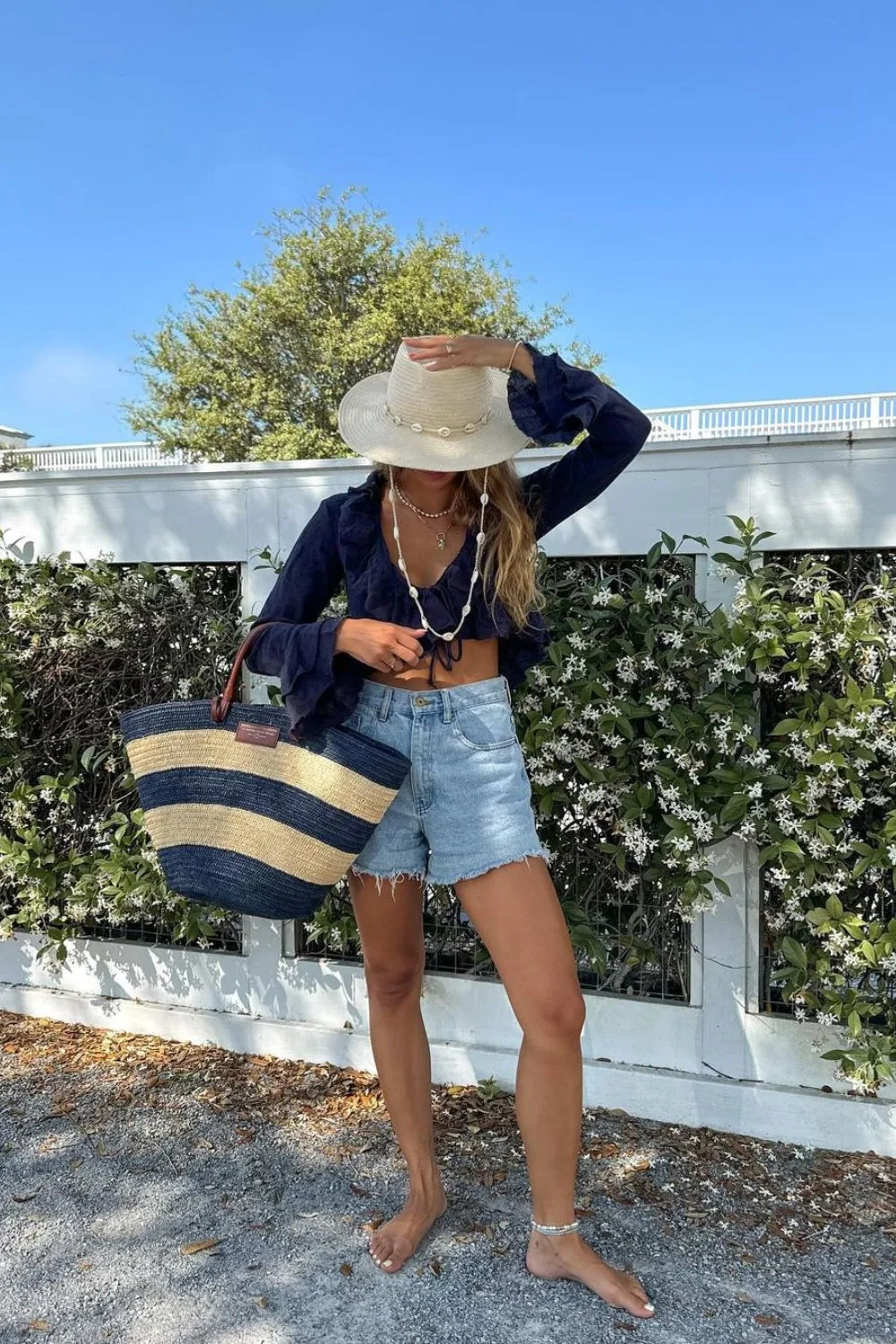 long sleeve top and high waisted denim shorts