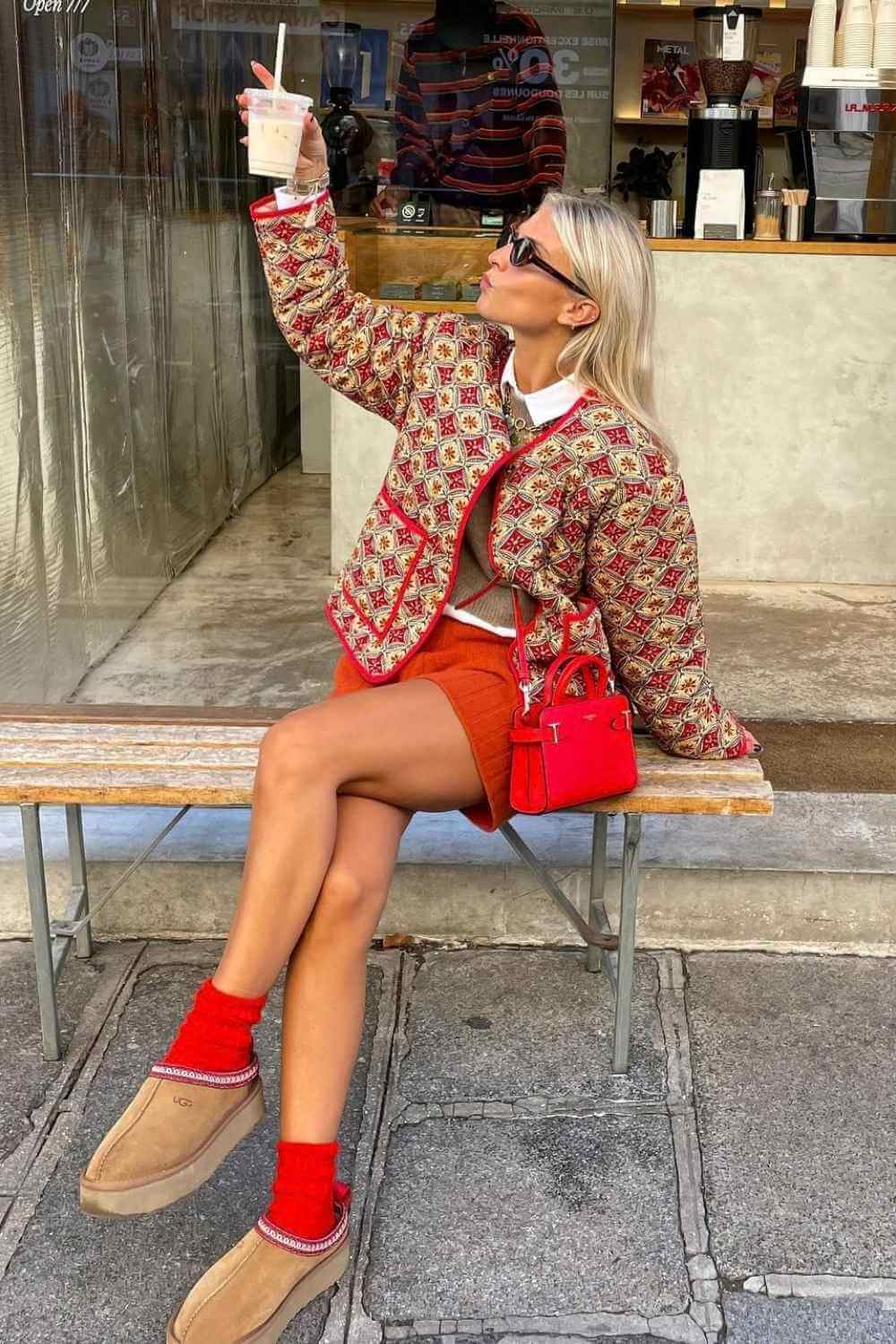 printed quilted jacket with red mini skirt and mini Uggs