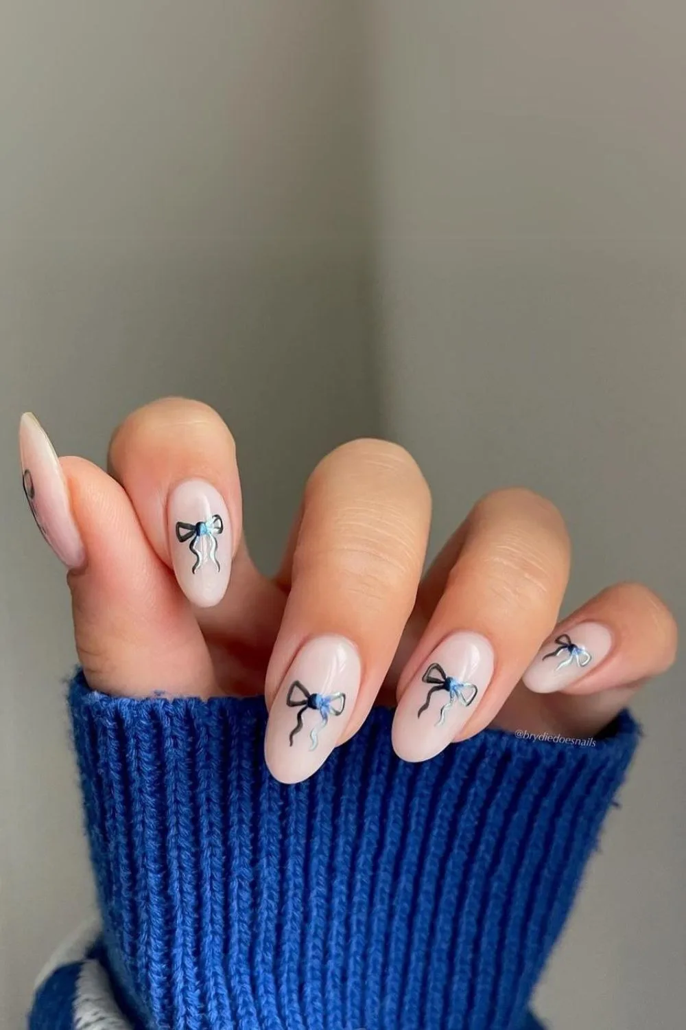 subtle coquette nails with chrome bows