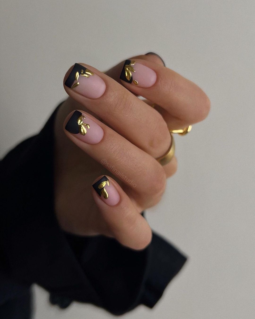 Abstract black and gold french tip nails