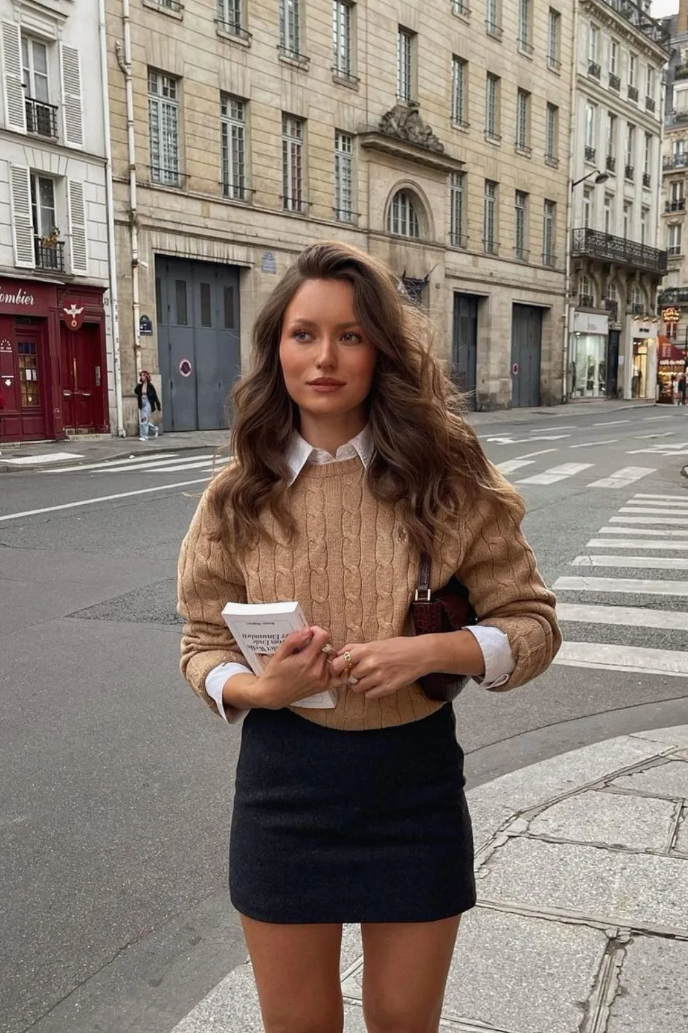 Beige cable sweater with white shirt and mini skirt