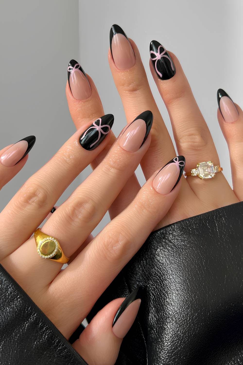Black French mani with accent pink bows