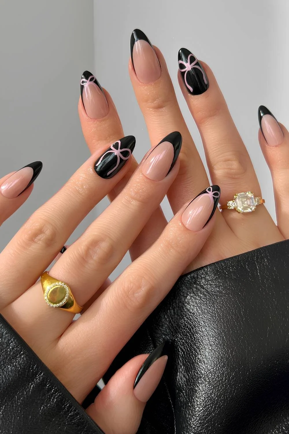 Black French mani with accent pink bows