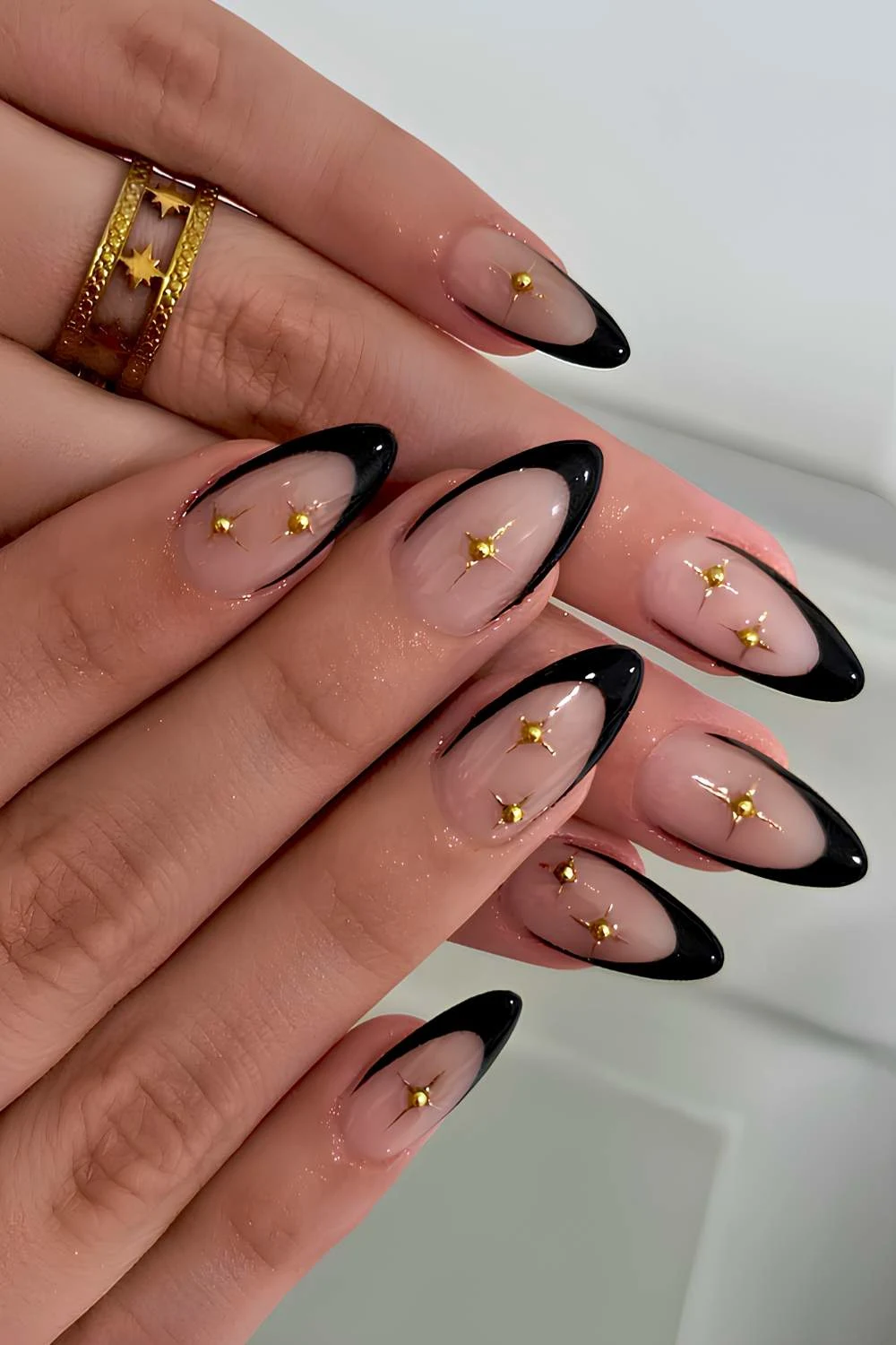 Black French mani with gold celestial art