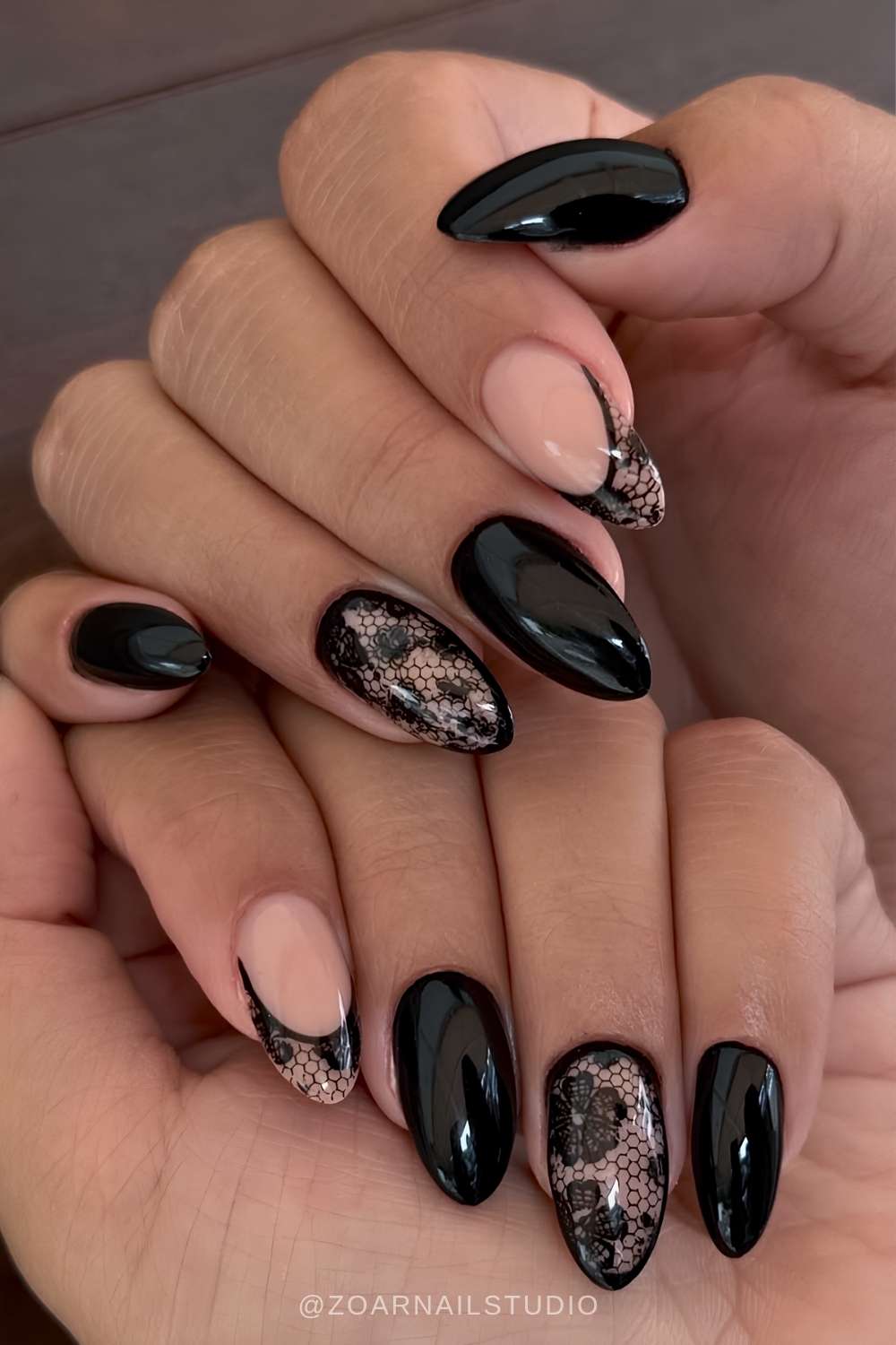 Black almond nails with accent lace art