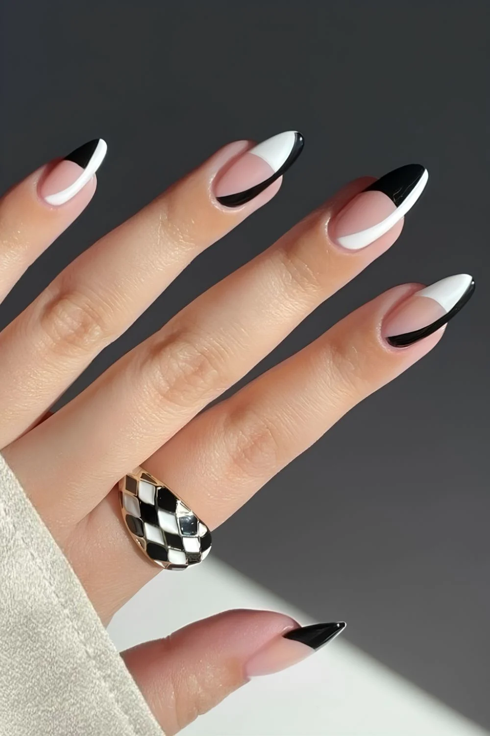 Black and white French nails with side swoop accents