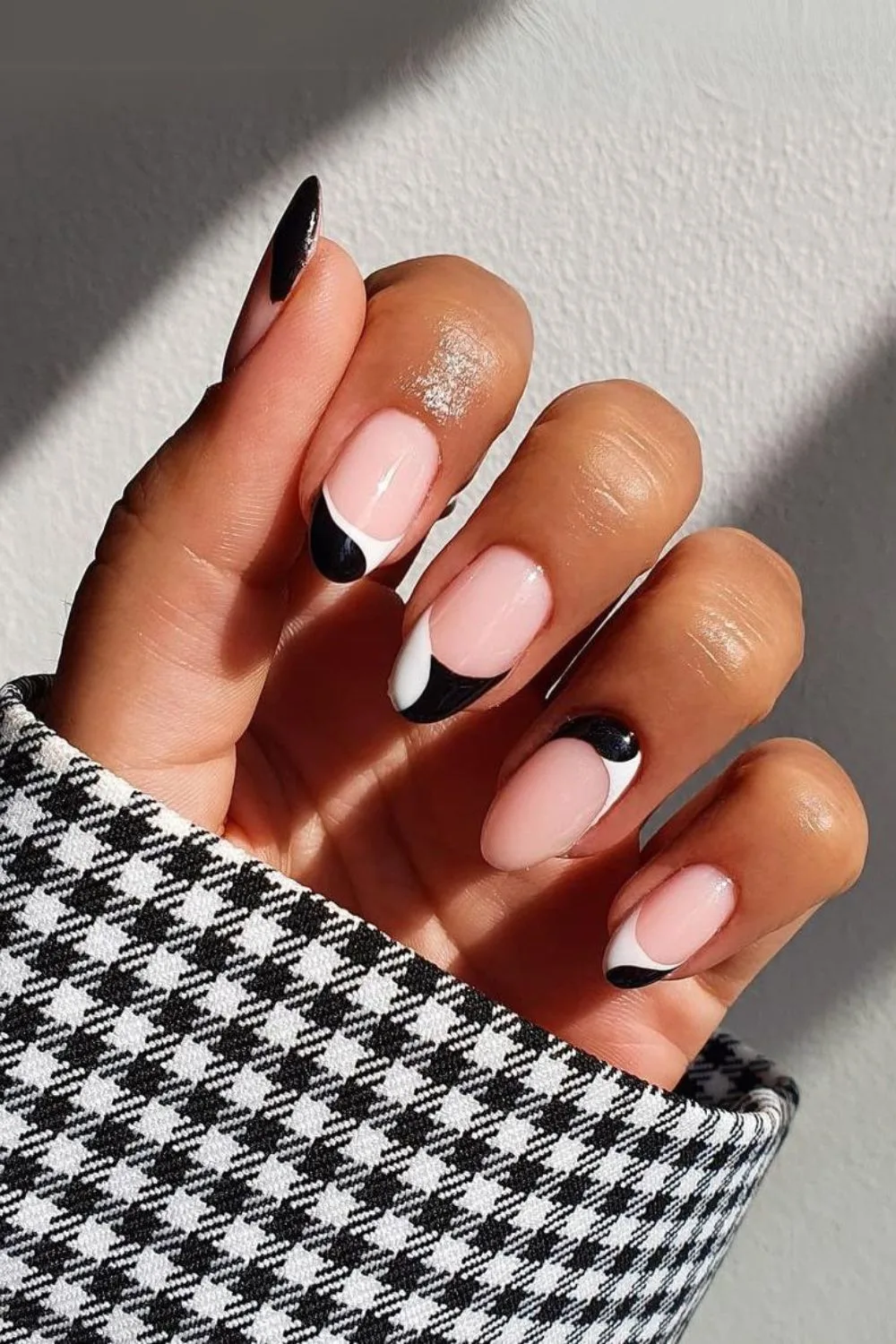 Black and white french mani with one tip reversed