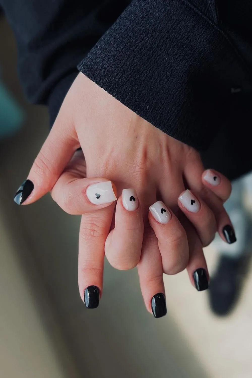 Black and white nails with tiny hearts