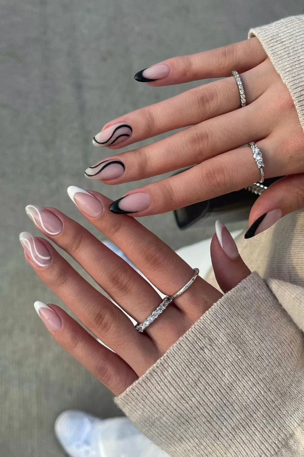 Black and white nails with wavy line accents