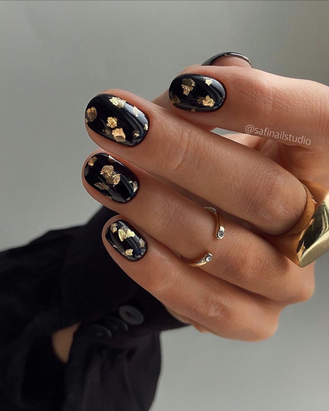 Black mani with gold foil flecks