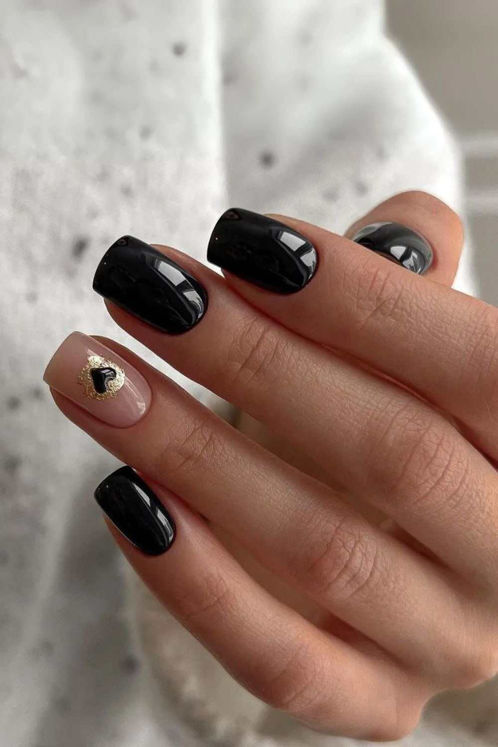 Black mani with tiny heart accent