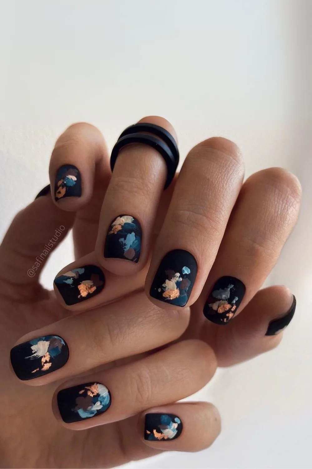 Black matte nails with abstract brush stroke design