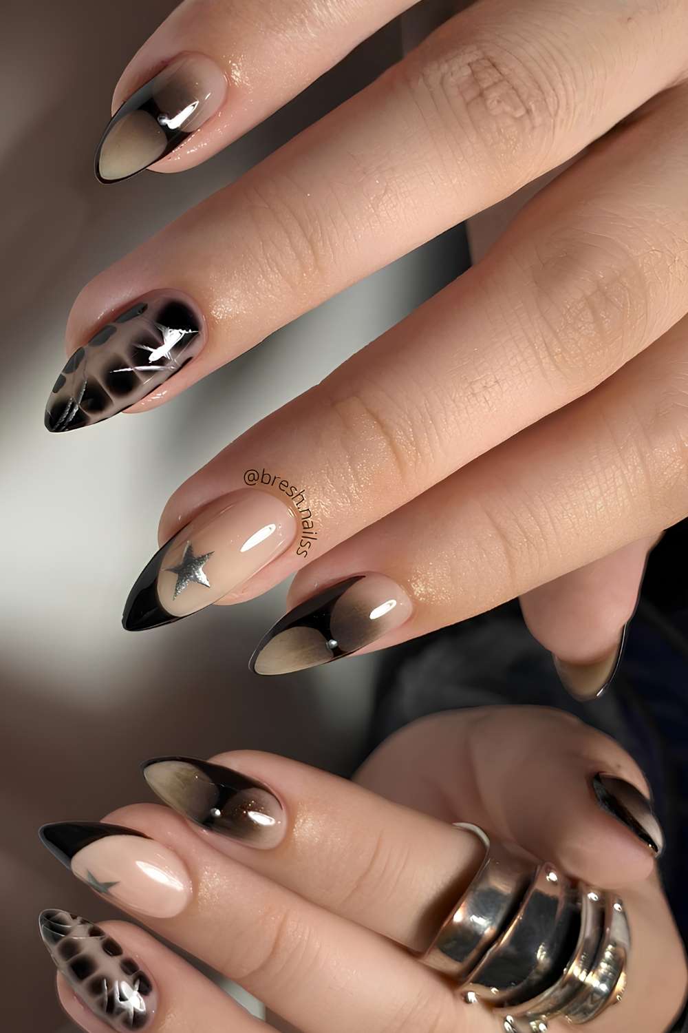 Black mix and match mani with stars and animal print