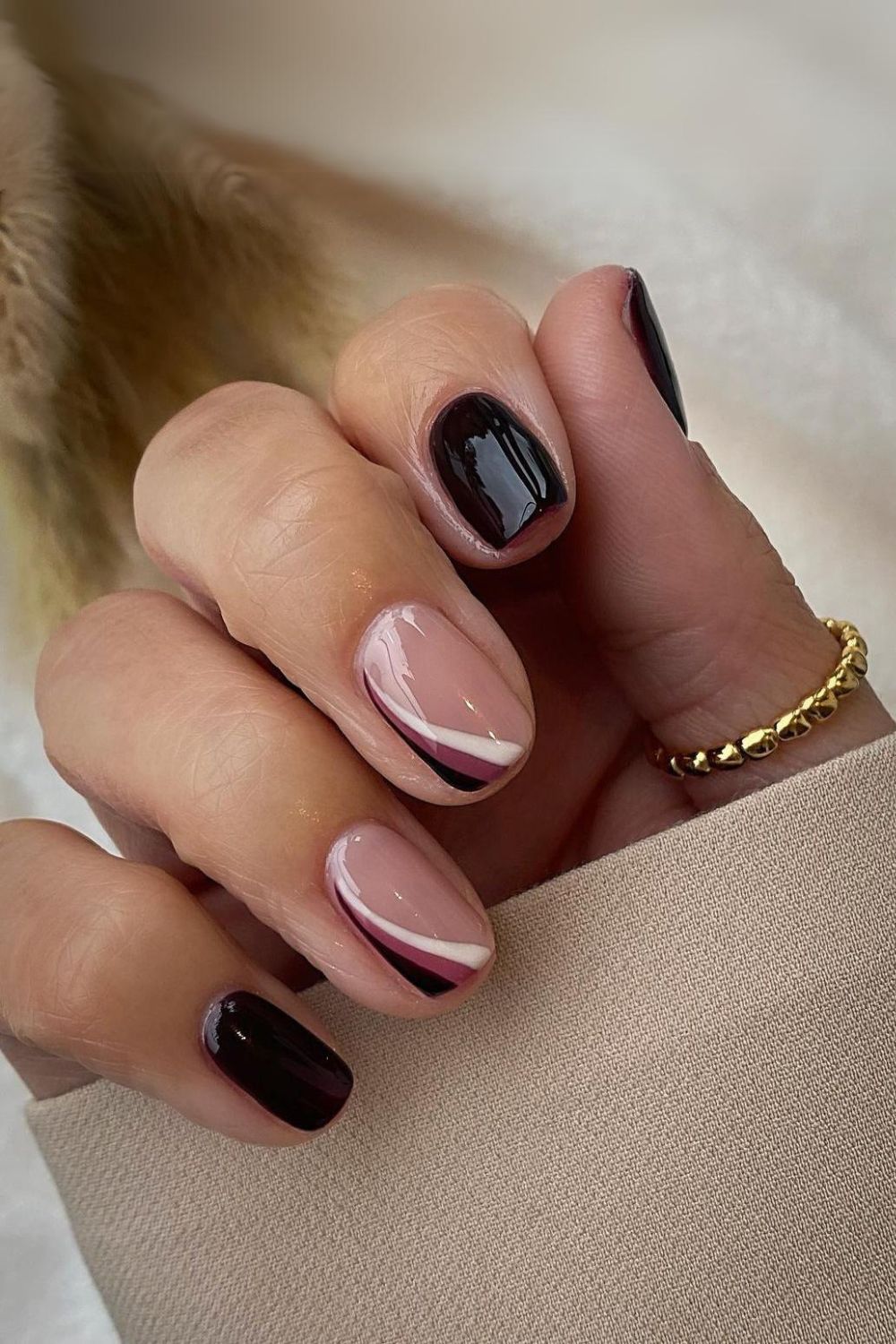 Black nails with white and mauve stripes