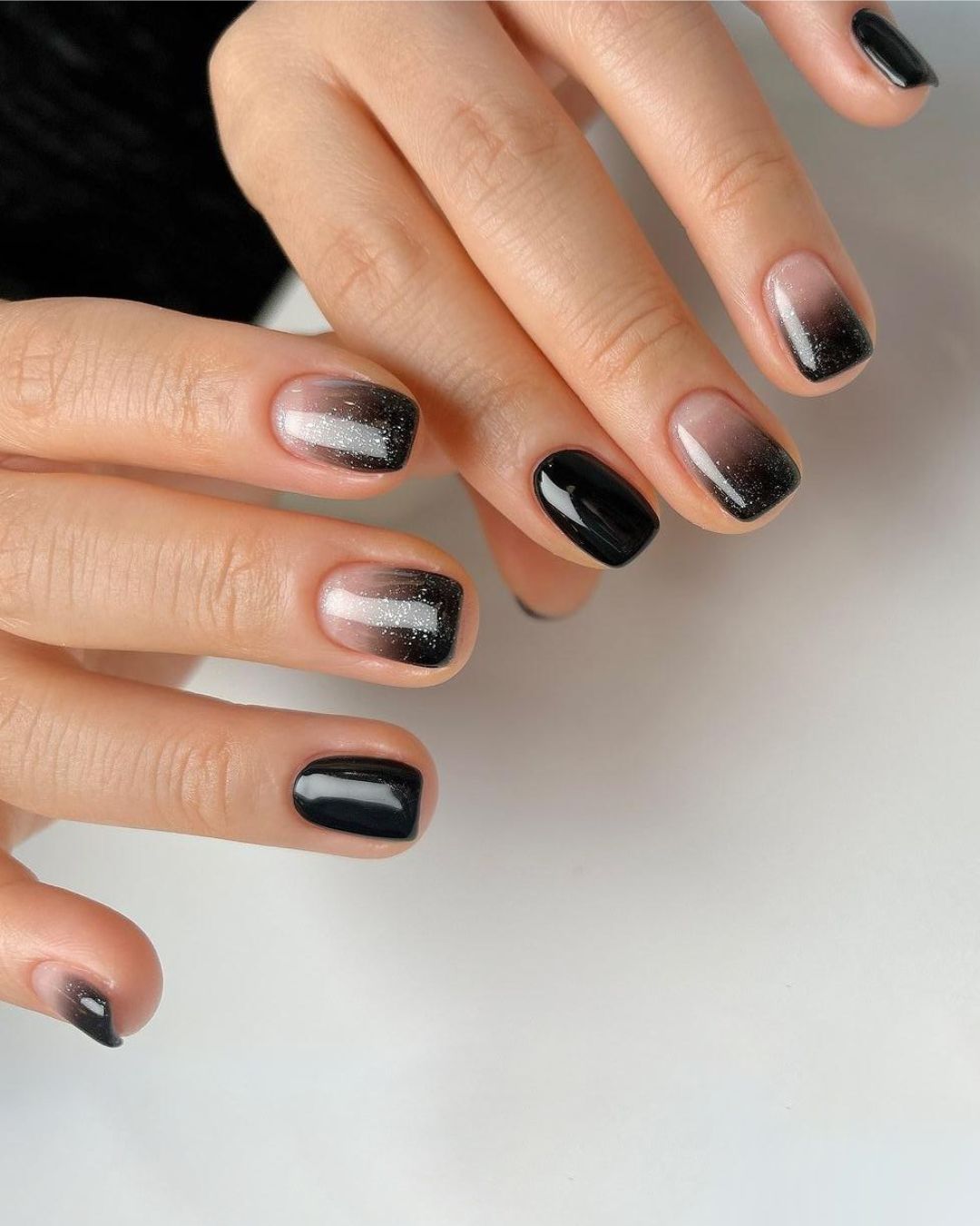 Black ombre nails with glitter