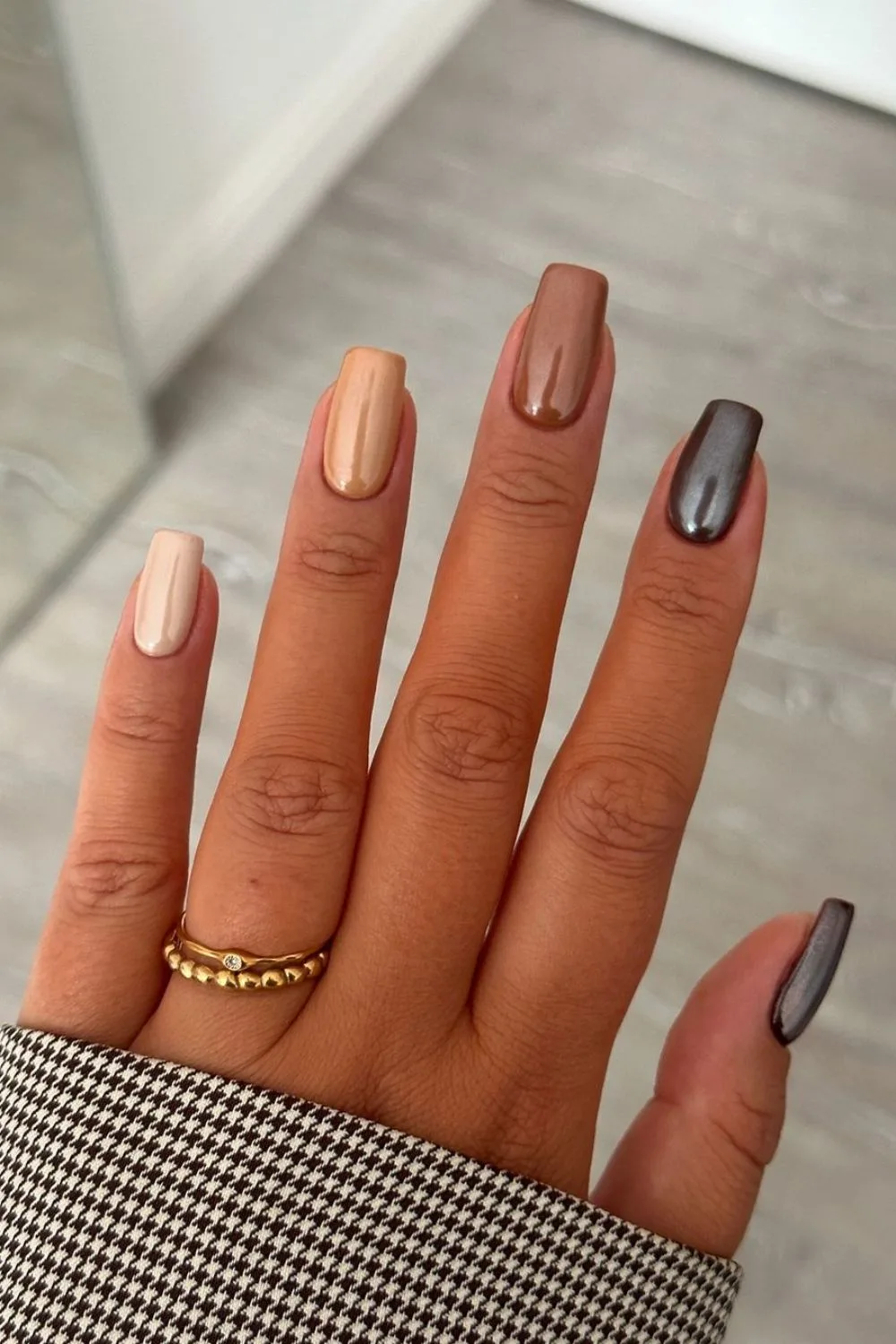 Black-to-beige chrome gradient nails