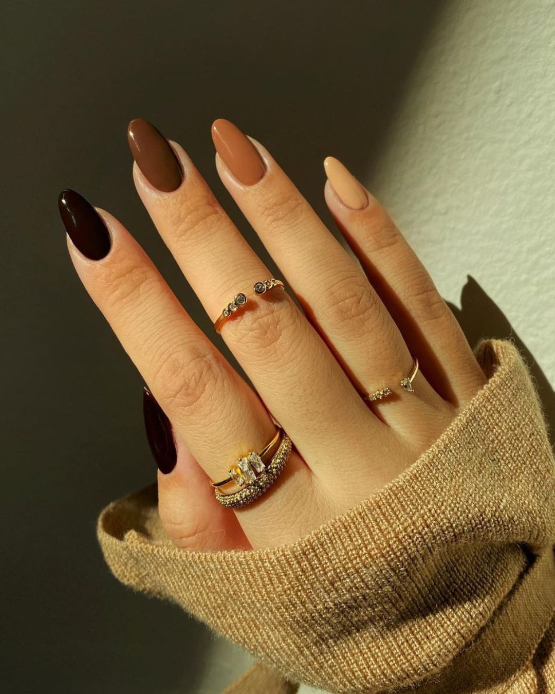 Black to beige gradient skittle manicure