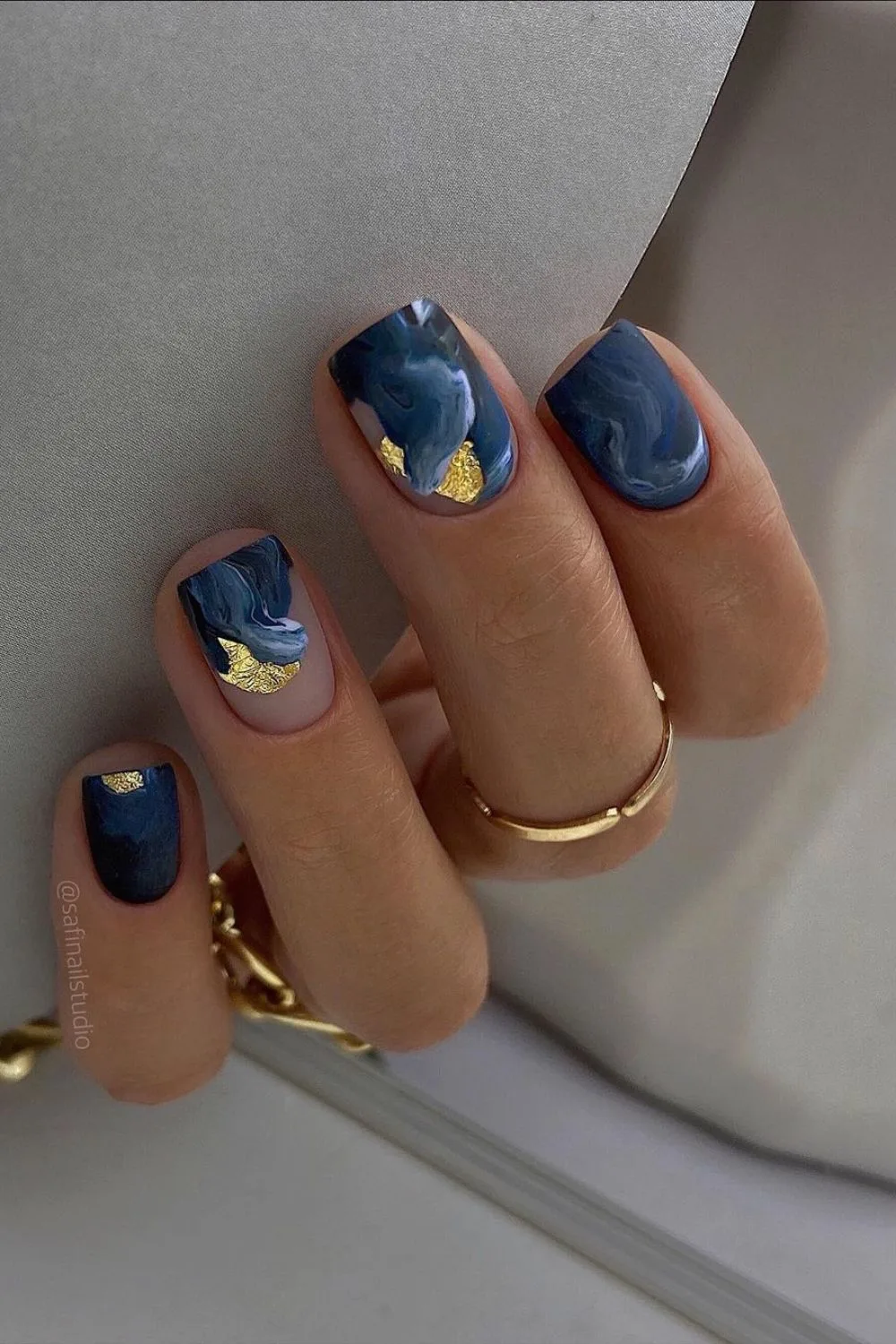 Blue marble nails with gold foil accent