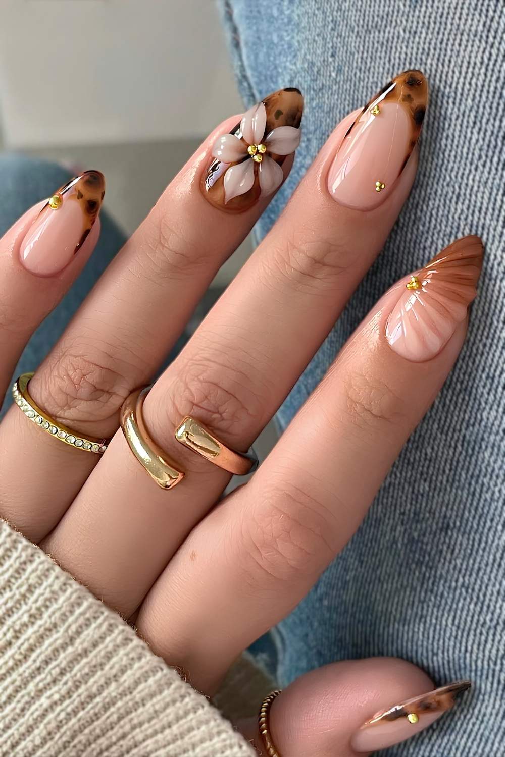 Brown tortie shell nails with textured flowers