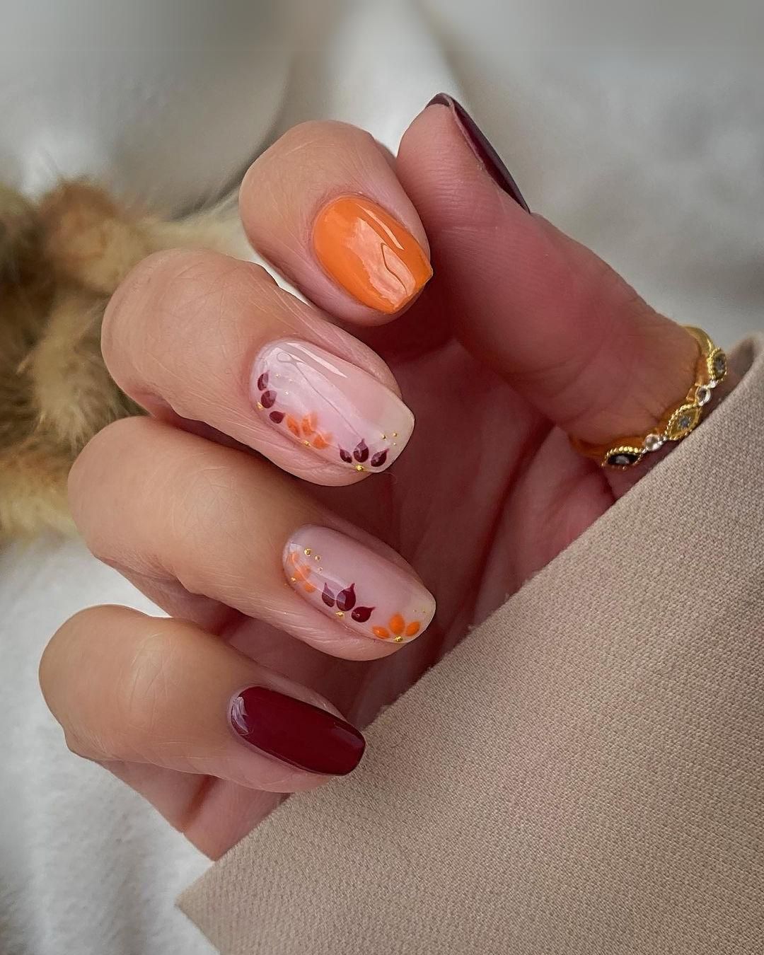 Burgundy and orange floral nails