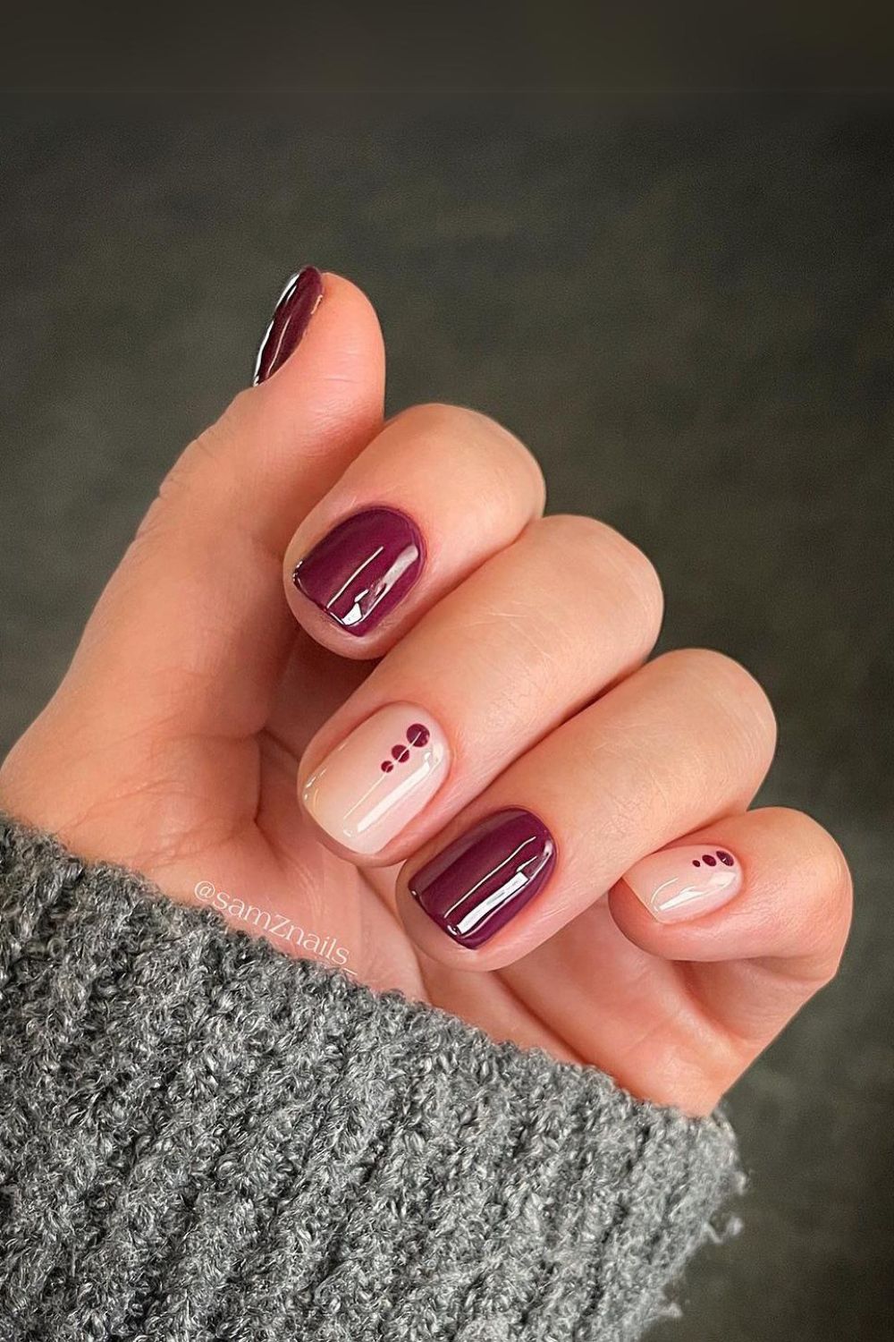 Burgundy and nude nails with dot accents