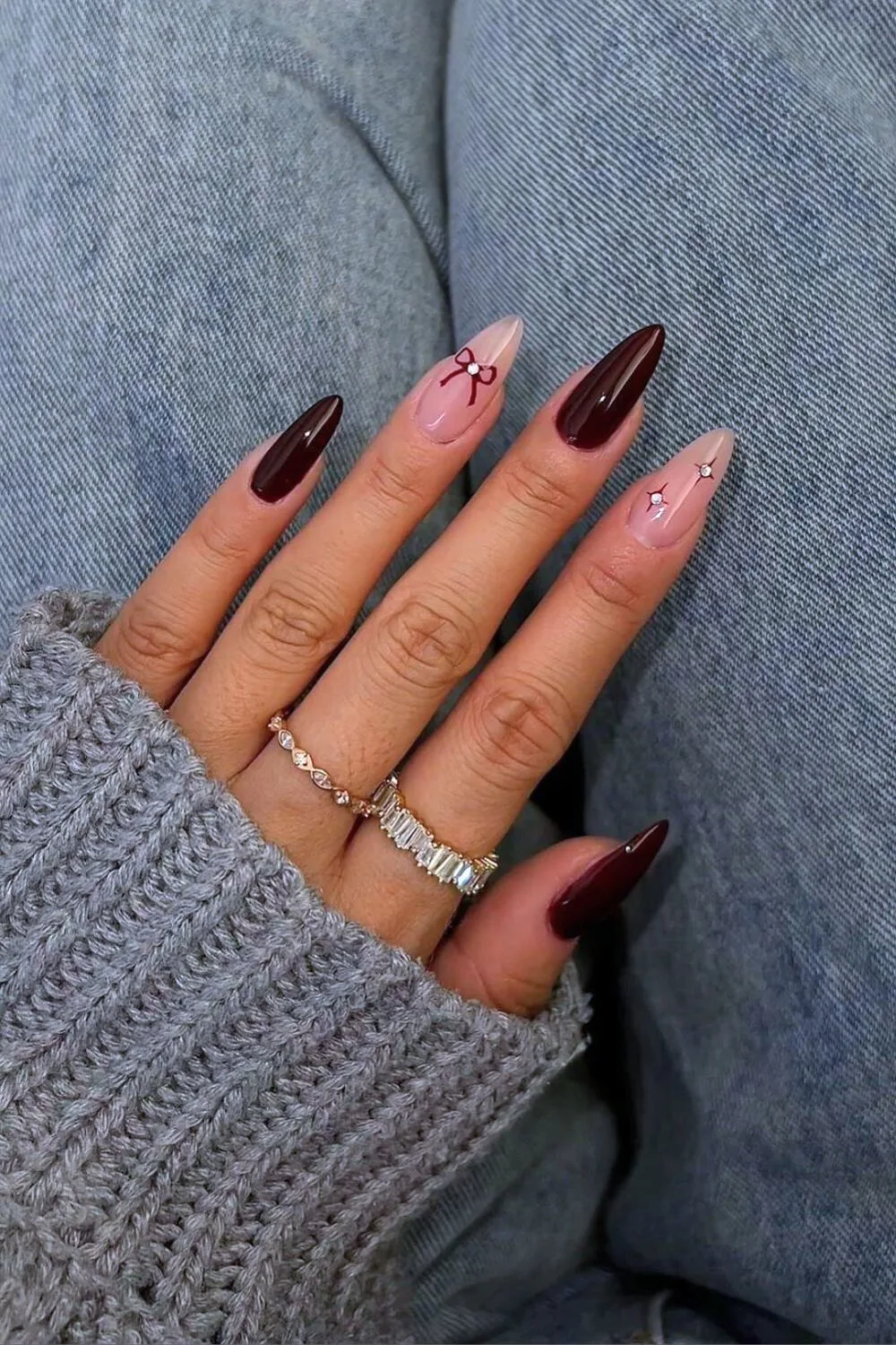 Burgundy coquette nails with bows and studs